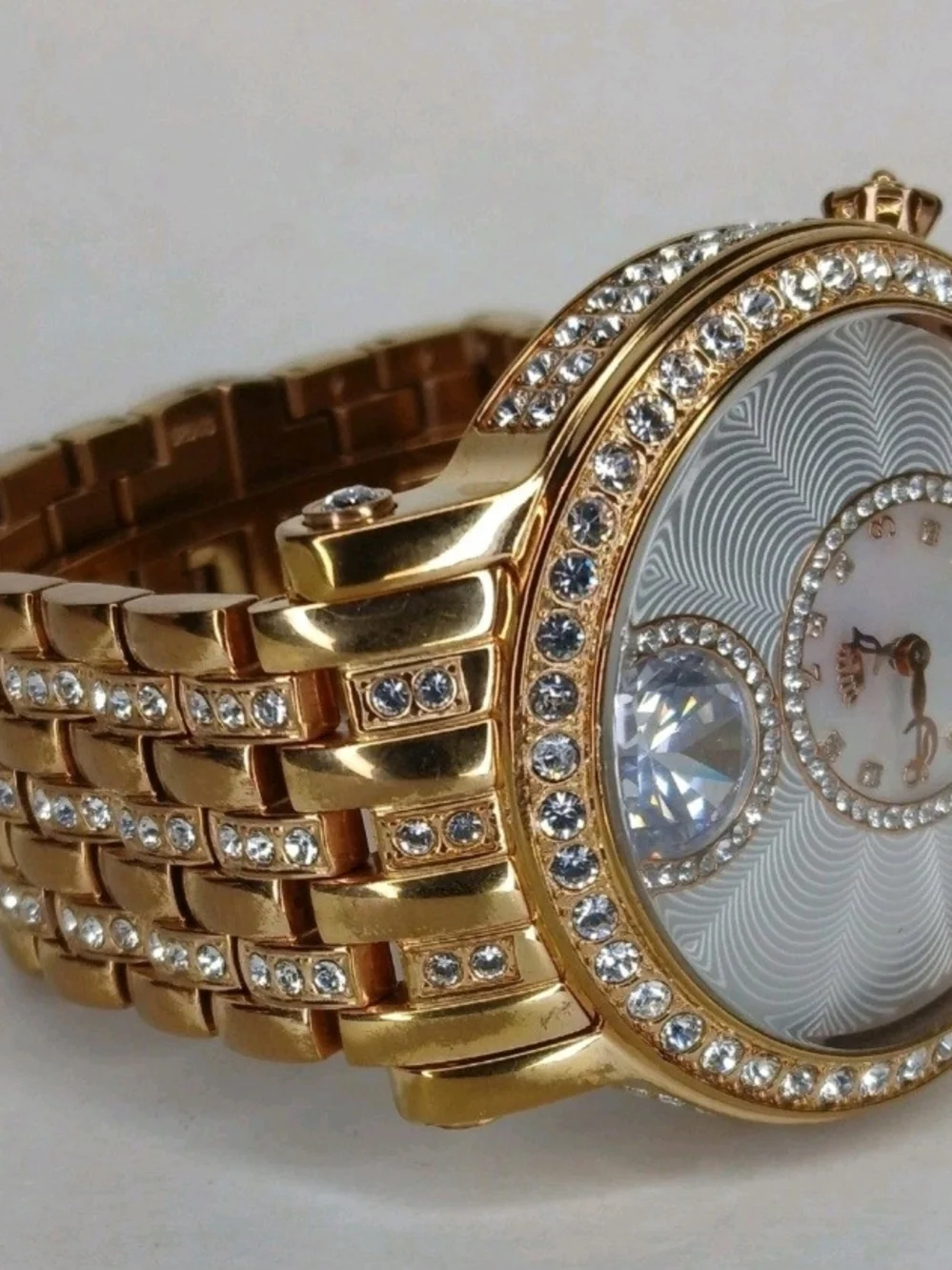 ​Juicy Couture Gold Tone Crystal Bezel Floating Solitaire Watch